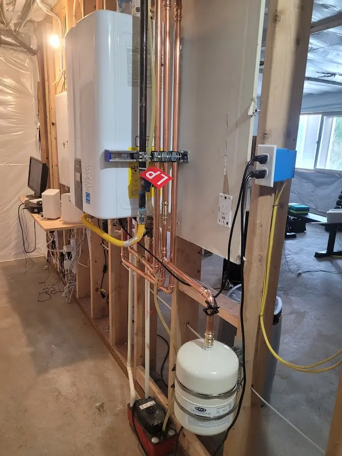 Licensed plumber repairing a kitchen sink in Thiensville