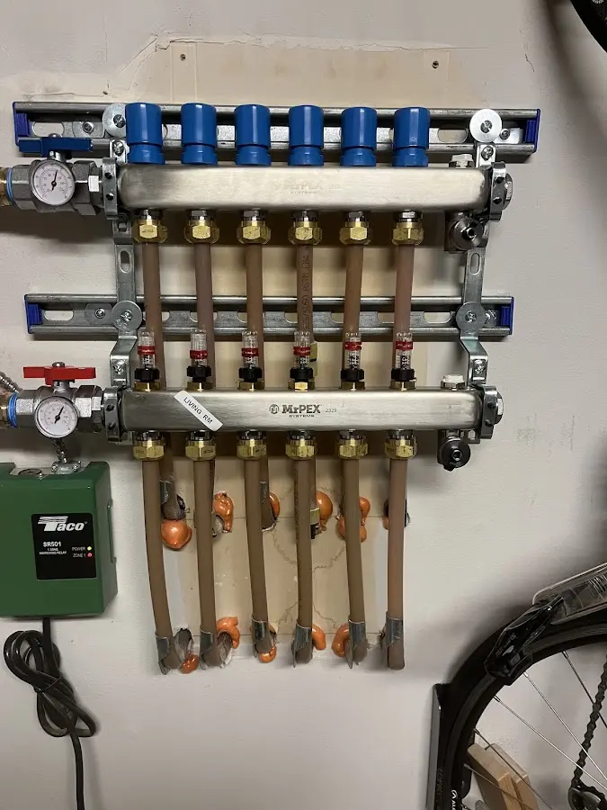 Plumber performing Water Heater Repair at a residential property in Thiensville